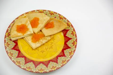 Pancakes with red caviar on a light background with beautiful bokeh Stock Photos