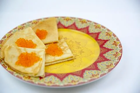 Pancakes with red caviar on a light background with beautiful bokeh Stock Photos