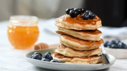 Pancakes stack with blueberries and honey Stock Footage 116611347