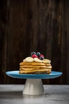 Pancakes stack on plate decorated with fresh berry fruits Stock Photos