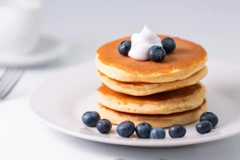 Pancakes stack on white plate. Pancake day Stock Photos