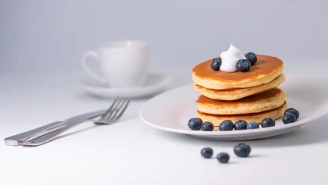 Pancakes stack on white plate. Pancake day Stock Photos