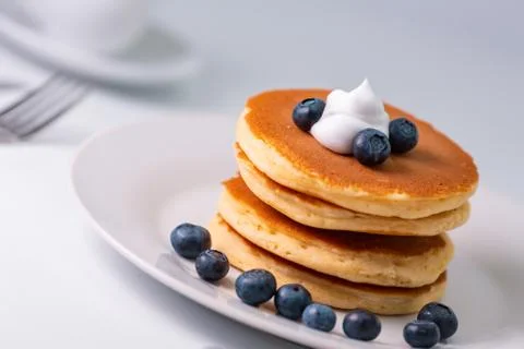 Pancakes stack on white plate. Pancake day Stock Photos