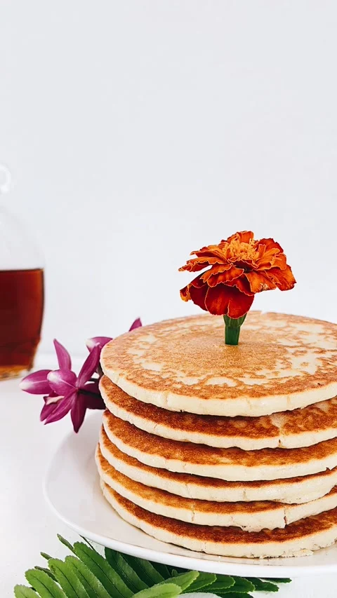 Pancakes On a table, Stack of pancakes paired with Plants Stock Footage 227406531