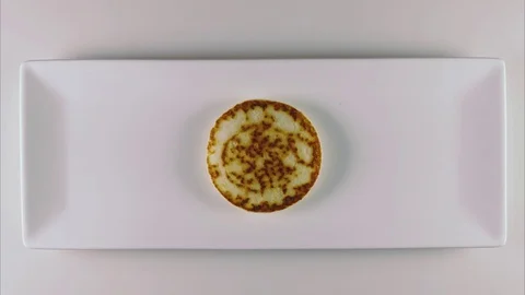 Pancakes on a white rectangular plate with topping 스톡 동영상 75034334