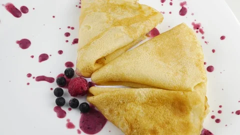 Pancakes.Folded triangle.Served on a white plate. 스톡 동영상 128697237