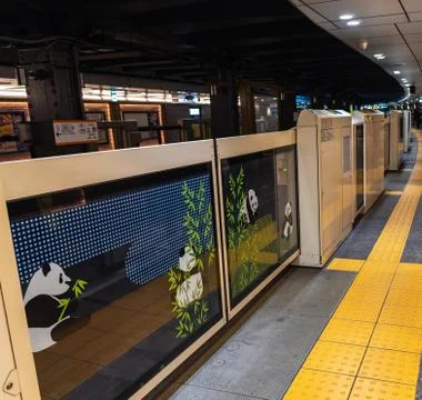 Panda platform screen doors of Tokyo metro subway Ueno station. Stock Photos