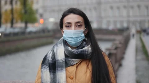 Pandemic, portrait of a young middle eastern woman wearing protective mask on Stock Footage 149402705