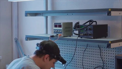 Pandown. Engineer is soldering an electronic component on electric board 스톡 동영상 105972013