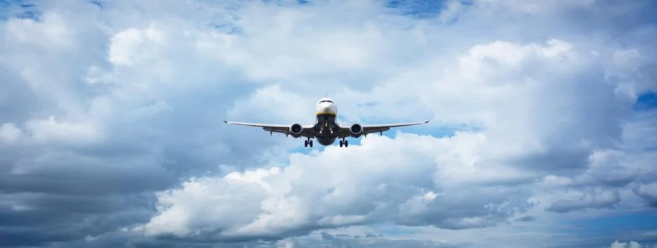 Pane flying out of the clouds Stock Photos