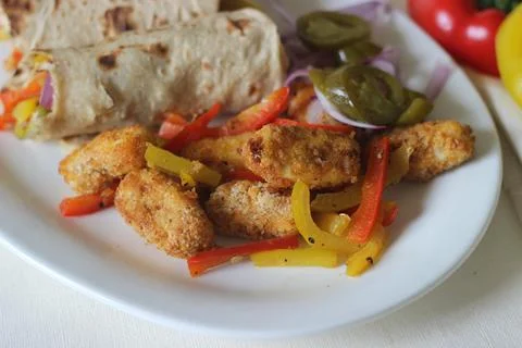 Paneer bell pepper rolls. Breaded and air fried cottage cheese, sauteed bell  스톡 사진