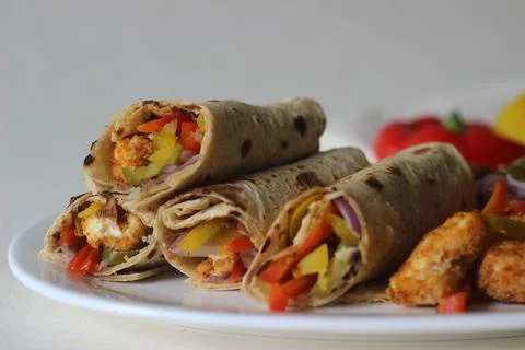 Paneer bell pepper rolls. Breaded and air fried cottage cheese, sauteed bell  스톡 사진
