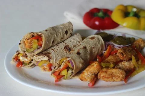 Paneer bell pepper rolls. Breaded and air fried cottage cheese, sauteed bell  스톡 사진