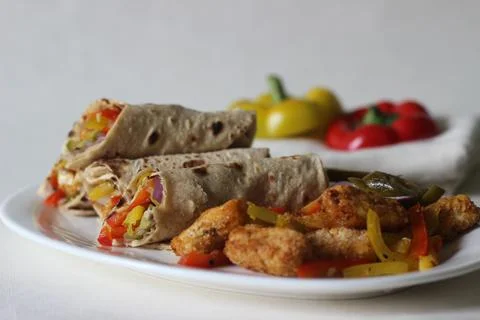 Paneer bell pepper rolls. Breaded and air fried cottage cheese, sauteed bell  스톡 사진