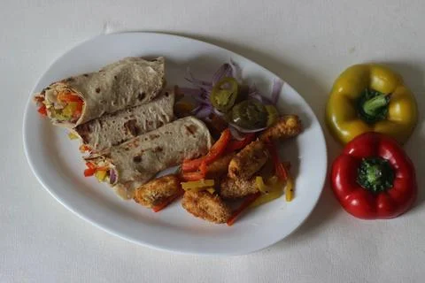 Paneer bell pepper rolls. Breaded and air fried cottage cheese, sauteed bell  스톡 사진