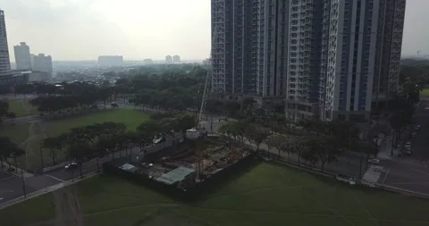 Panel aerial flight over construction site.  Crane close up. Stock-Footage 131203520