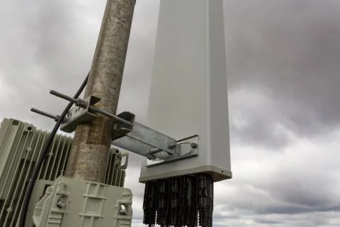 Panel antenna of GSM DCS UMTS LTE bands is as part of communication equipment of Stock Photos