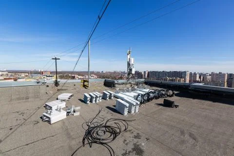 Panel antennas of GSM DCS UMTS LTE bands and outdoor radio units are as parts of Stock Photos
