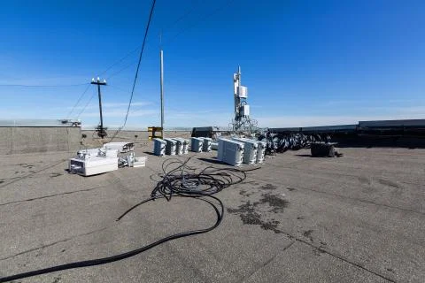 Panel antennas of GSM DCS UMTS LTE bands and outdoor radio units are as parts of Stock Photos