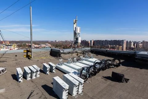 Panel antennas of GSM DCS UMTS LTE bands and outdoor radio units are as parts of Stock Photos