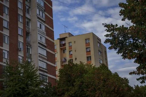Panel blocks and trees under blue sky Stock Photos