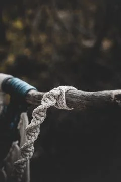 Panel of blue and white macrame on a decorative branch in nature Stock Photos