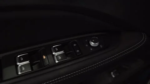 Panel with a button for the electric drive of glass on the armrest. Black Video stock 156962254