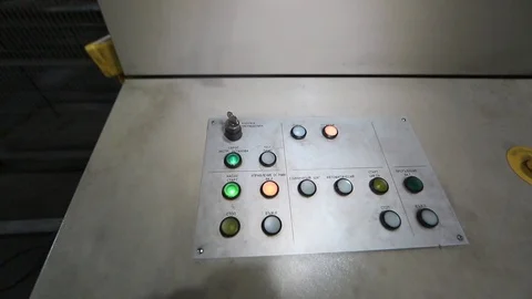 The panel with buttons at the factory. control, red button. power button - Stock Footage 94898701