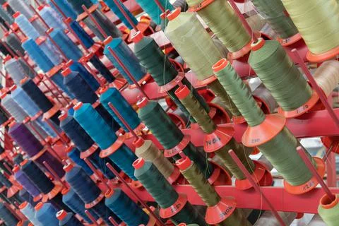 Panel of colored yarn rolls for textile industry 스톡 사진