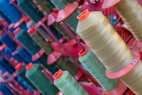 Panel of colored yarn rolls for textile industry 스톡 사진