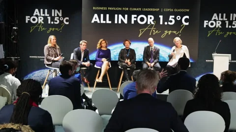 Panel of experts talk to audience at COP 26 Climate change summit Stock Footage 165076737