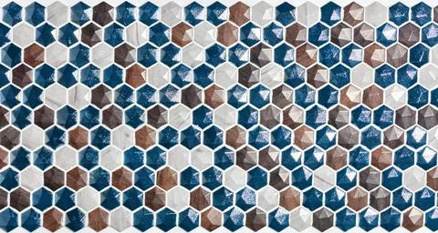 Panel of a hexagonal mosaic made of natural polished stone figurines. Stock Photos
