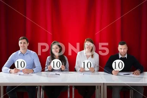 Panel Judges Holding 10 Score Signs Stock Photos