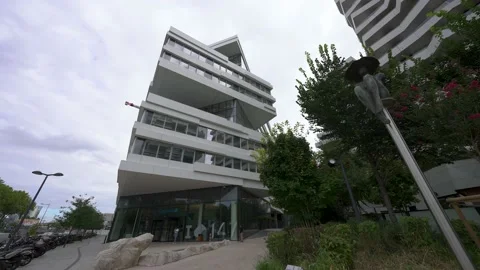 Panel on the left, Capgemini building 147 with logo, low angle shot with a Stock Footage 206056974