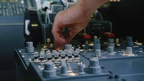 Panel of switches on an aircraft flight deck. Pilot controls the aircraft. Video stock 93522499