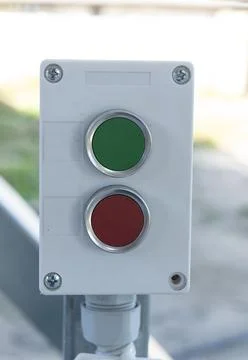 Panel with two buttons for controlling equipment in red and green colors Stock Photos