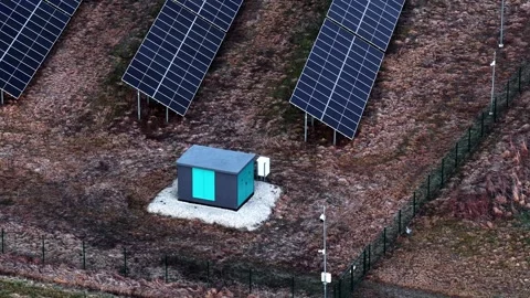Panels and power unit collecting sun, creating sustainable, renewable Stock Footage 332808093