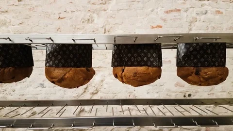 Panettons head down after baking in the oven Video stock 82503869