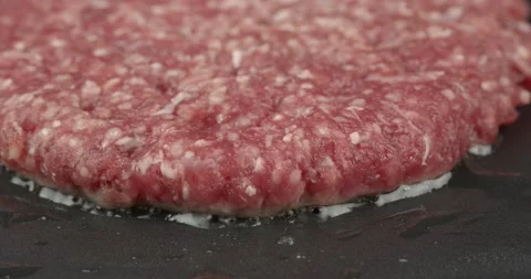 Panfrying a burger patty closeup Stock Footage 136426160