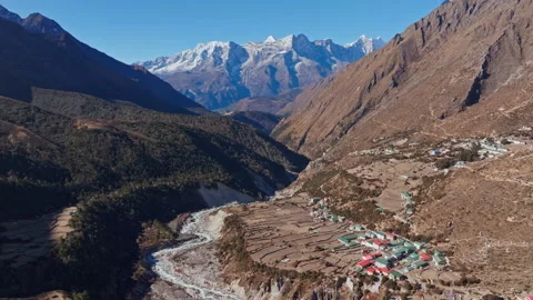 Pangboche perching amid dramatic Himalayan peaks, functioning as key staging Video stock 302885410