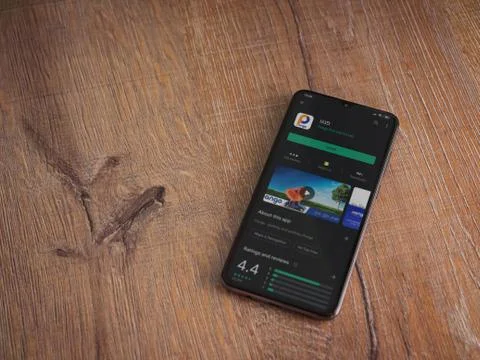 Pango app play store page on the display of a black mobile smartphone on wood Stock Photos
