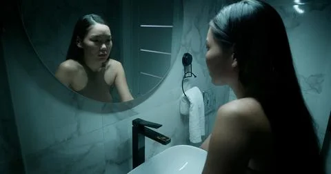 Panic attack, Woman look mirror. Mental health struggle. Nervous breakdown. Stock Photos