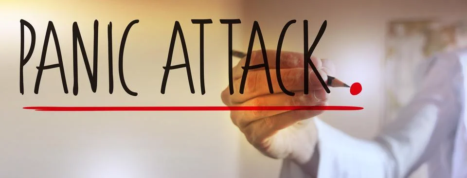 PANIC ATTACK words written by doctor's hand. Mental health healthcare medical Stock Photos