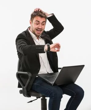 Panic manager looks at his watch. Stock Photos