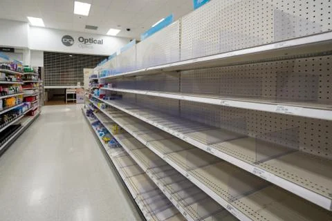 Panic shopping empty store shelves Stock Photos