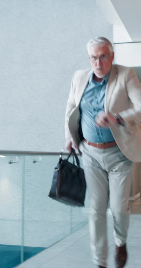 Panic, urgency and watch with business man in workplace hallway for delay or Stock Footage 317809719