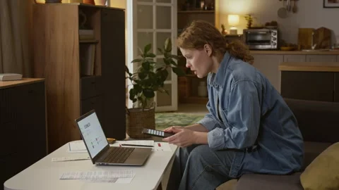 Panicking Woman Checking Bank Account on Laptop after Money Transfer Alert Stock Footage 329052601