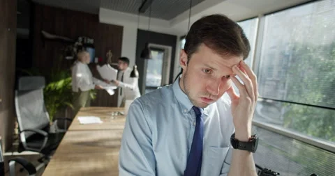Panicky manager in office, workers argue and throw papers to each other faces at Stock Footage 158165377