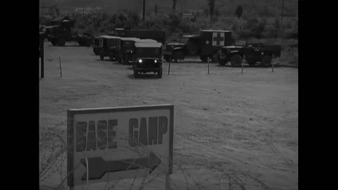 PANMUNJOM - 1952 - Jeeps leave the base camp parking one by one. The Jeeps drive Stock Footage 316680549
