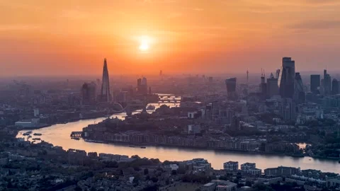 Panned sunset to night time lapse view of the urban skyline of London Stock Footage 262437271